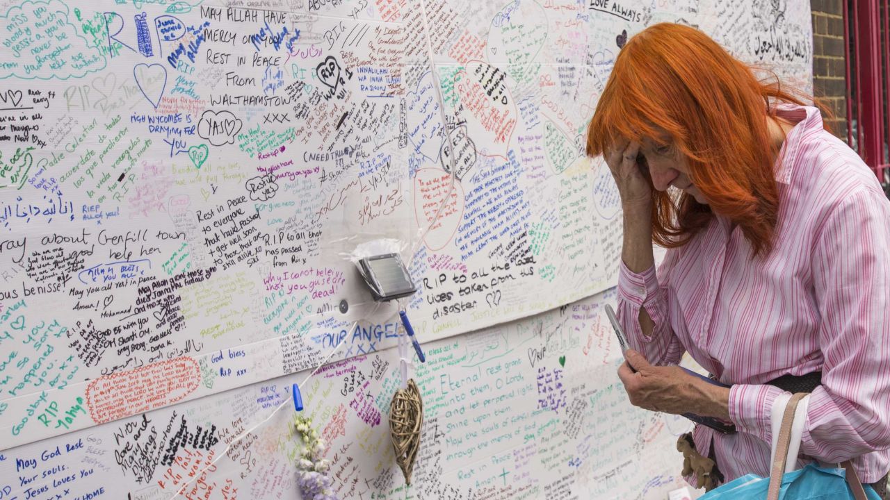 Kathy Lancaster, 70, travelled from east London to pay her respects at the memorial wall near Latymer Christian Centre. "I thought I would be OK until I got off the train and saw that," she said, gesturing towards the charred remains of Grenfell Tower, "all those children..."