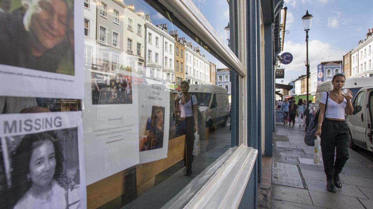 Missing posters are taped inside the window of a local business on Portobello Road, a popular market street in west London.