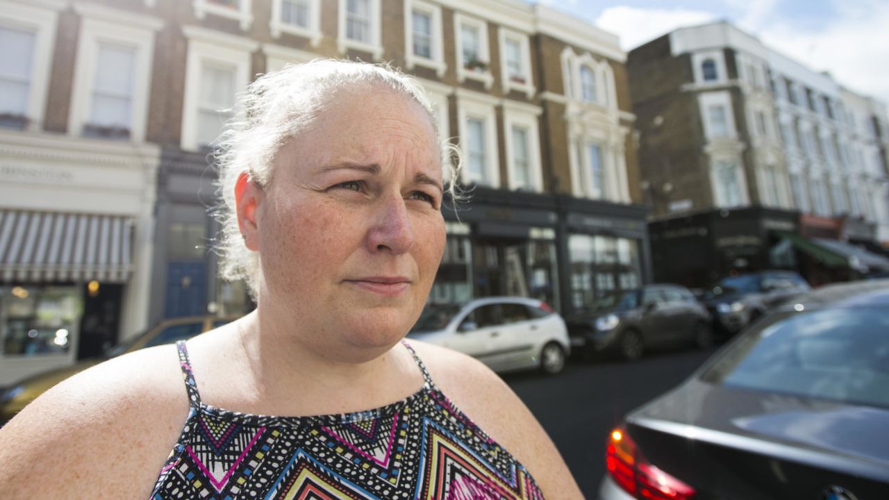 Spinola stands outside Notting Hill Community Church after picking up donated supplies.