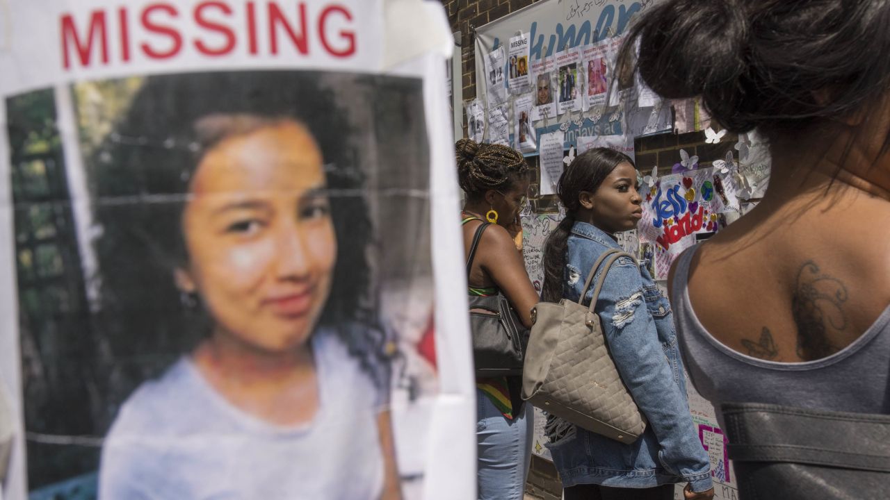 A poster for a missing girl is taped to a pole outside Latymer Christian Centre, one of several community hubs established for people affected by the fire.
