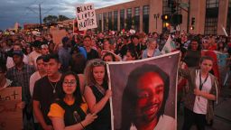Supporters of Philando Castile held a portrait of Castile as they marched along University Avenue in St. Paul, Minnesota leaving a vigil at the state Capitol on Friday, June 16, 2017. The vigil was held after St. Anthony police Officer Jeronimo Yanez was cleared of all charges in the fatal shooting last year of Castile. 