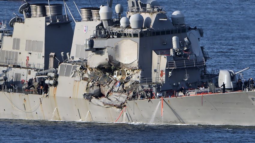 The US Navy guided missile destroyer USS Fitzgerald arrives at the US Naval base, Yokosuka, in the Japanese prefecture of Kanagawa on June 17. The US and Japan launched a major search operation to find seven missing American sailors on June 17 after their navy destroyer collided with a container ship, crushing the side of the military vessel.