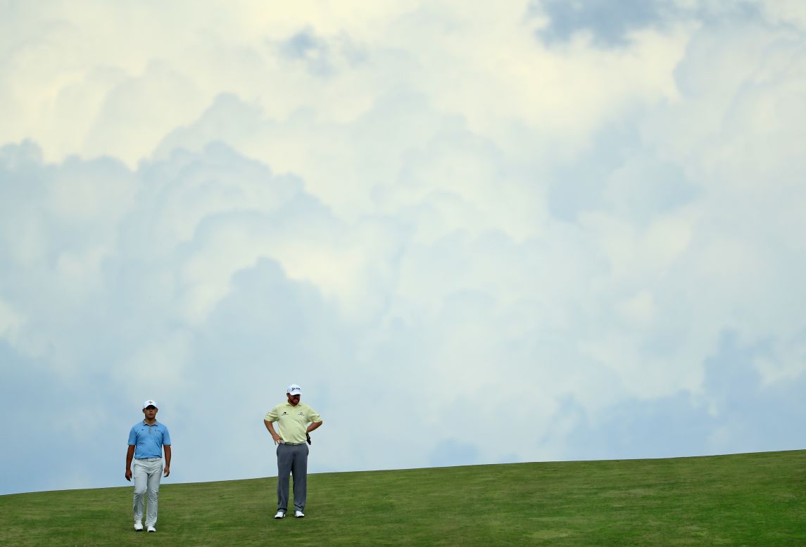 It's behind you. South Korea's Si Woo Kim (left), the Players champion, ended nine under in sixth place, while JB Holmes (right) was back in 14th at six under. 