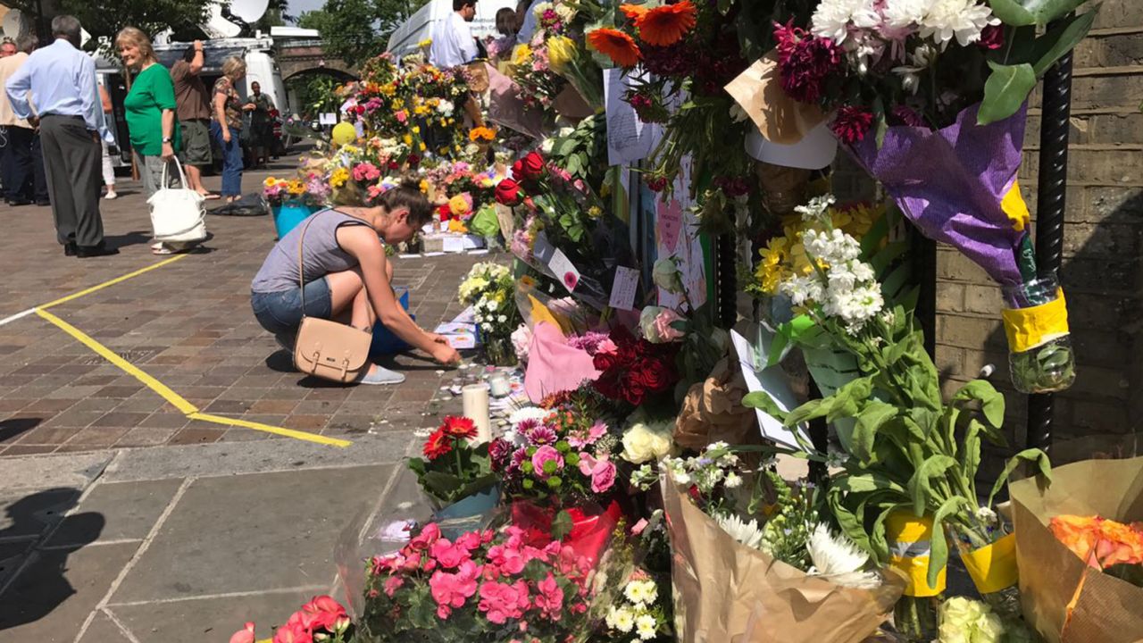 Flowers are placed outside the Notting Hill Methodist Church in west London on Sunday, June 18, as a memorial to those who died in Grenfelll Tower fire. 