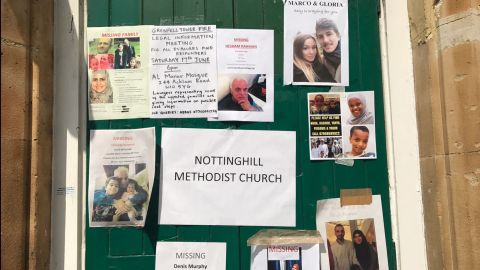 Missing people and informational flyers are posted on a door of the Notting Hill Methodist Church in west London on Sunday 18 June.