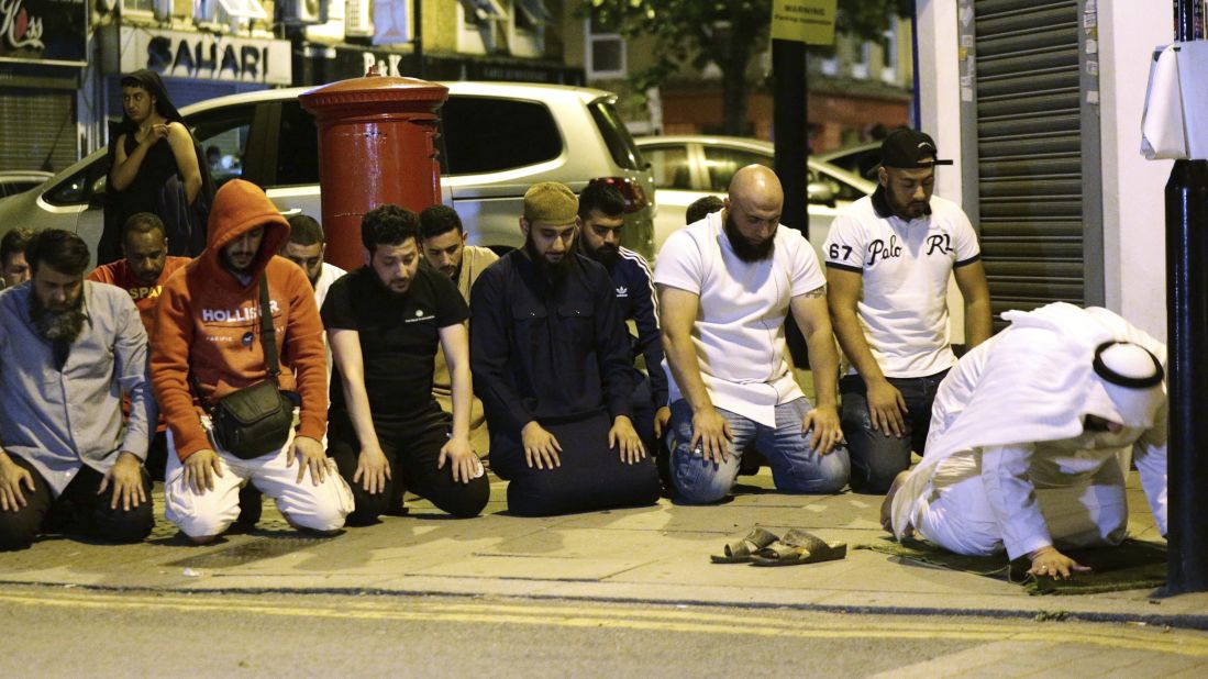 Locals pray near the mosque.