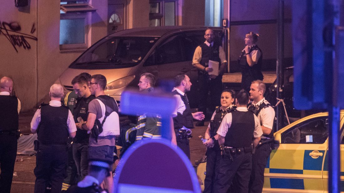 Police officers gather near a van on Whadcoat Road.