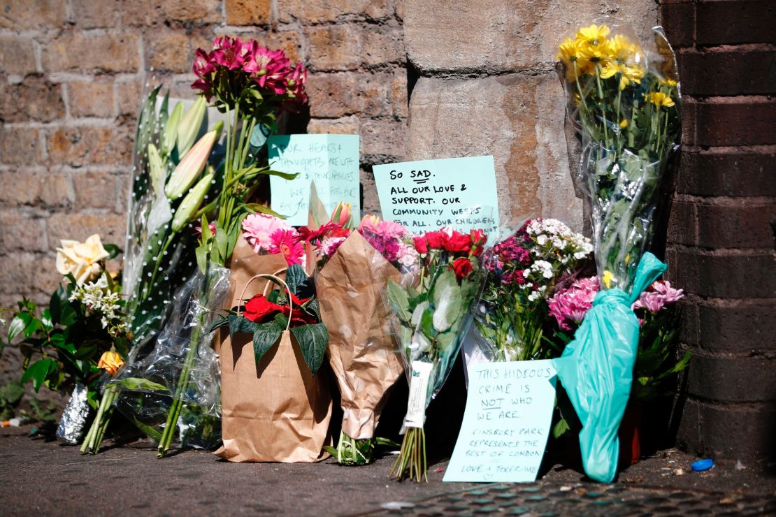 Flowers and tributes lie at a police cordon near the scene of the Finsbury Park attack.