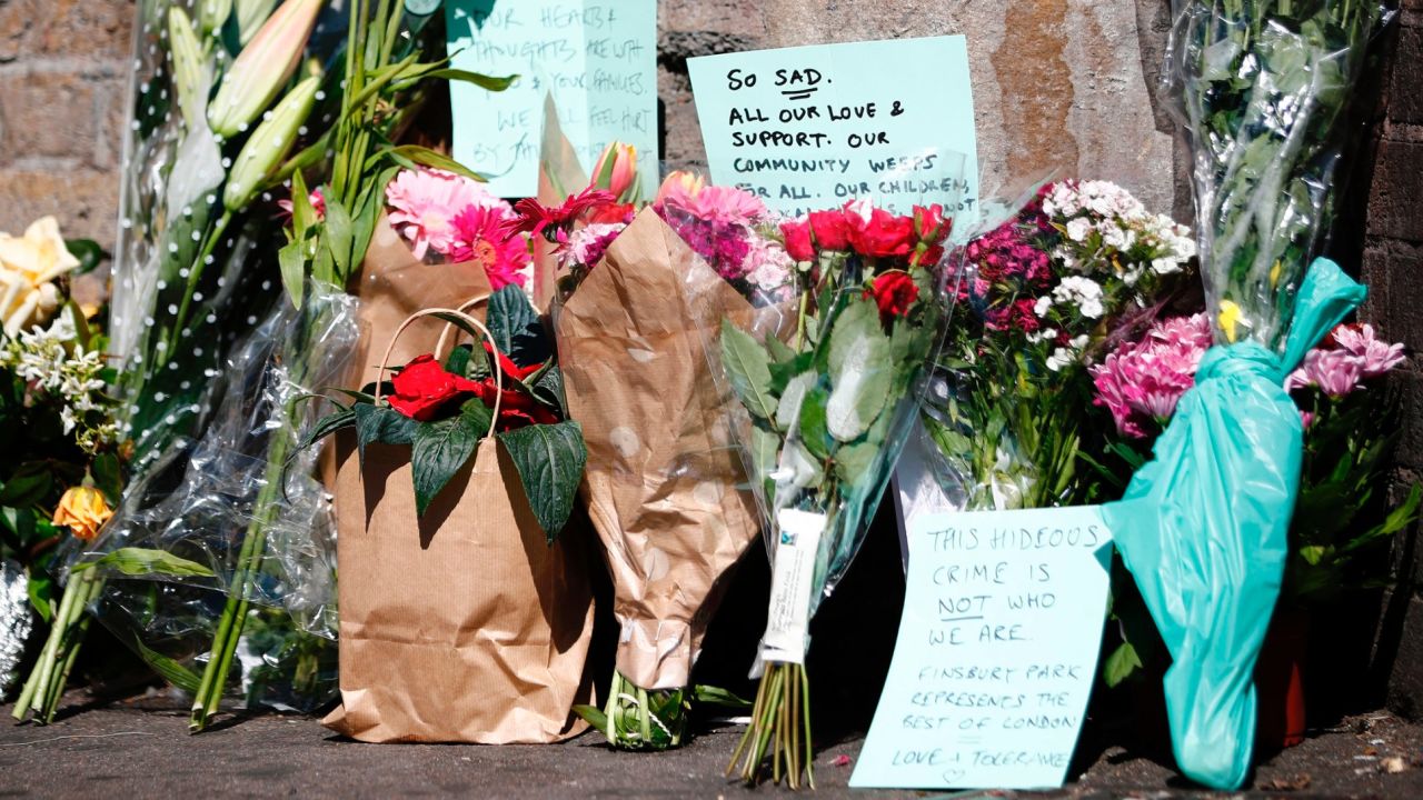 Flowers and tributes lie at a police cordon near the scene of the Finsbury Park attack.