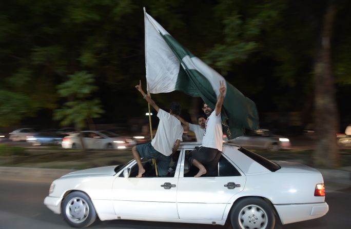 In Pakistan's capital Islamabad, cricket fans waved their national flag as they celebrated through the night. 