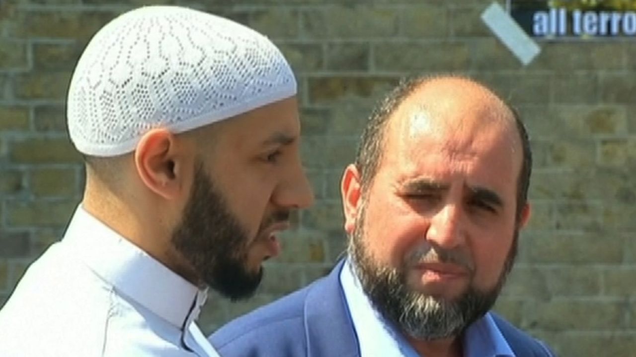 Imam Mohammed Mahmoud (in white hat and tunic) told the media what had happened outside his mosque was "a tragic and barbaric terrorist attack."