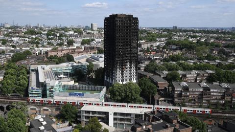 A Tube train passes the remains of Grenfell Tower on June 16.