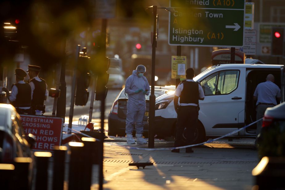 Investigators work at the scene.