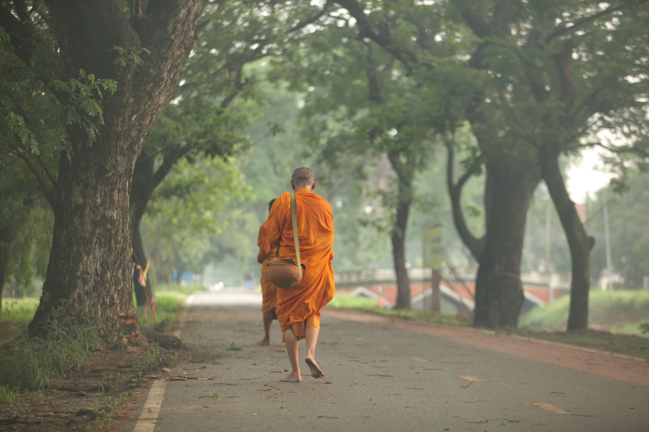 Every morning, Buddhist monks head out into the streets of Ayutthaya to collect food offerings from devotees. 