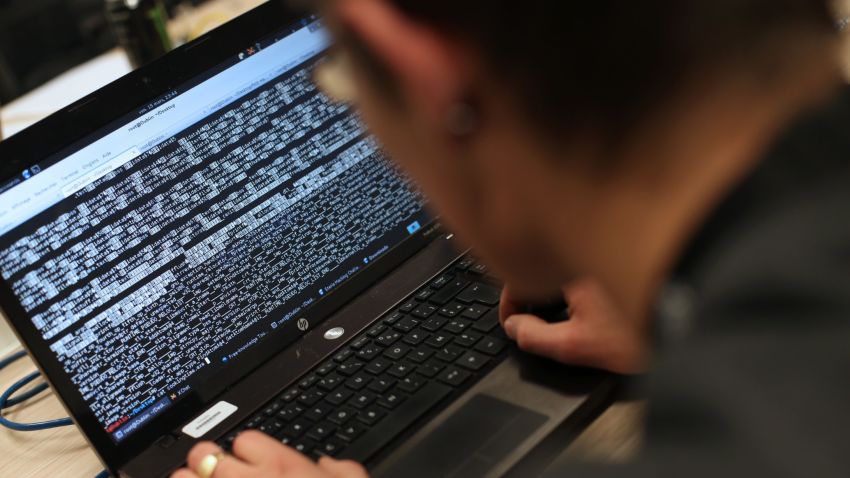 A student from an engineering school attends, on Meudon, west of Paris, overnight on March 16, 2013, the first edition of the Steria Hacking Challenge. AFP PHOTO / THOMAS SAMSON / AFP / THOMAS SAMSON        (Photo credit should read THOMAS SAMSON/AFP/Getty Images)