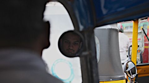 Priyank Mathur rides in a rickshaw through Mumbai. 