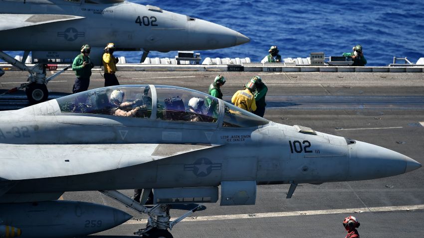 An F/A-18E and An F/A-18F (front) Super Hornet stand ready on the US navy's super carrier USS Dwight D. Eisenhower (CVN-69) ("Ike") in the Mediterranean Sea on July 7, 2016. 
The US aircraft carrier is deployed in support of Operation Inherent Resolve, maritime security operations and theater security cooperation efforts in the US 6th Fleet area of operations. Air Wings embarked aboard conducted strikes against the terrorist group ISIL in Libya, Iraq and Syria.  / AFP / ALBERTO PIZZOLI        (Photo credit should read ALBERTO PIZZOLI/AFP/Getty Images)