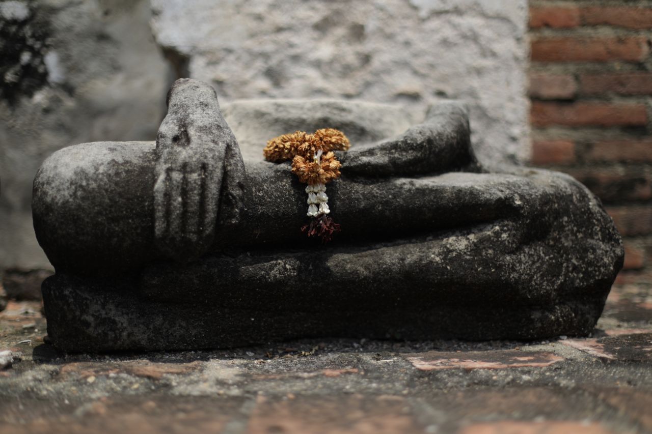 The haunting remains of Buddha statues -- many without heads or torsos -- lie throughout Ayutthaya's historical ruins, a constant reminder of the city's fall in 1767. 
