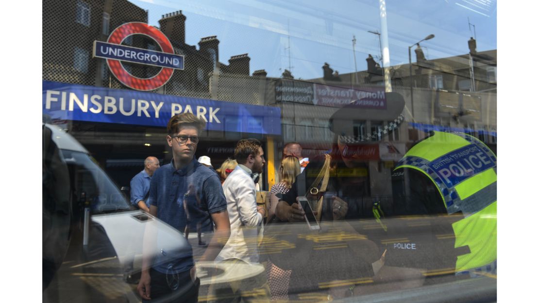 A policeman gives directions to people outside Finsbury Park station. Many on Monday morning were trying to navigate cordons blocking streets around the mosque.