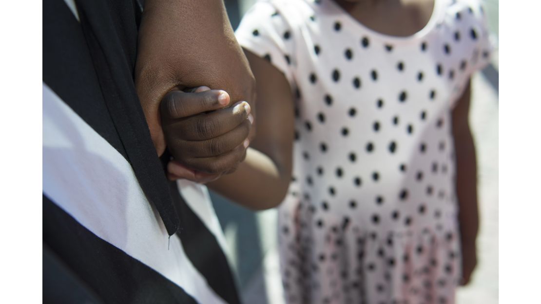 "We will continue. We will pray today, tomorrow, the day after. It won't deter us from our faith," says Zara, holding her daughter Mona's hand.