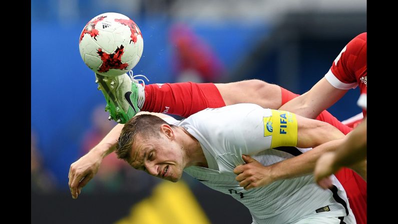 The boot of Russia's Georgi Dzhikiya comes close to New Zealand's Chris Wood during a Confederations Cup match on Saturday, June 17.