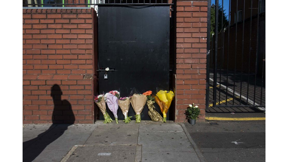 Flowers are left outside the back entrance to Finsbury Park Mosque in tribute to victims of the van attack. 