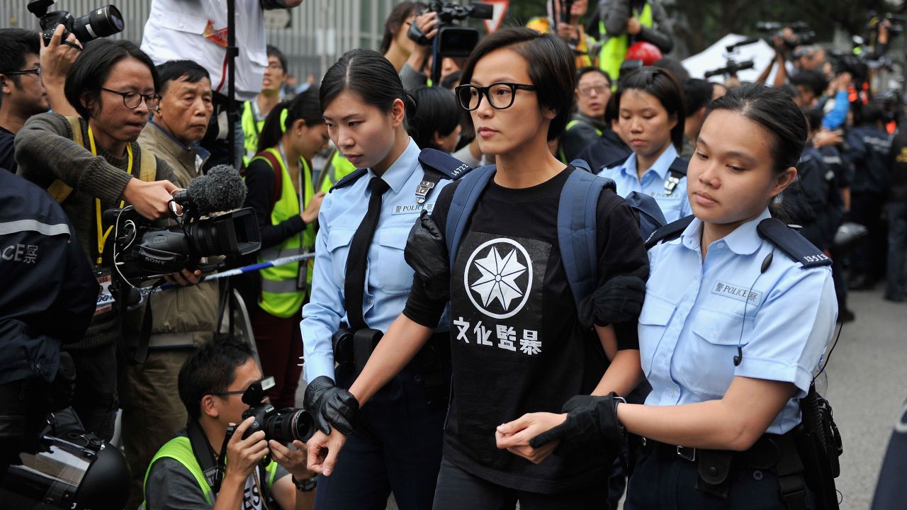 Ho is led away by police as they clear the last of the "Umbrella Movement" protest camps in December 2014.