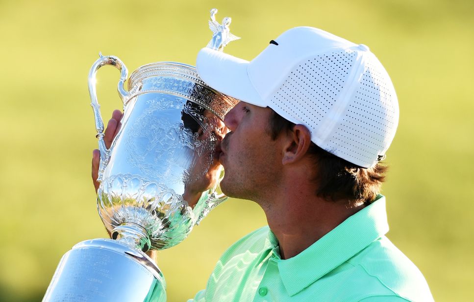 Brooks Koepka picked up the US Open trophy after triumphing at Erin Hills in Hartford, Wisconsin.   