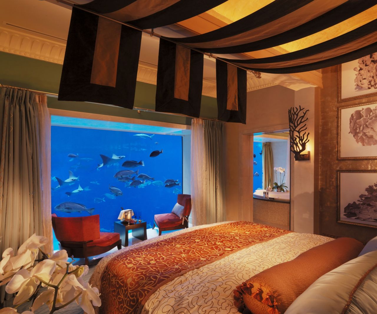 <strong>Sleep with the fishes -- </strong>Guests can look out of any of the three-floor suite's windows and see sharks and stingrays among 65,000 sea creatures occupying a humongous aquarium.
