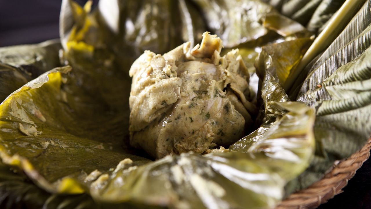Amaz's version of juanes (chicken, rice, olives and egg cooked together wrapped in leaf), a jungle staple.