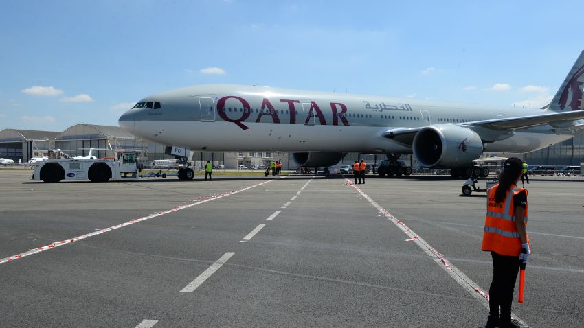 A Qatar Airways Boeing 777-300 is moved on the Tarmac of Le Bourget airport on June 18, 2017 on the eve of the opening of the International Paris Air Show.
Saudi Arabia, the United Arab Emirates, Bahrain and Egypt are among several countries that suspended ties with Qatar last week, including the suspension of all flights to and from Doha and an airspace ban on Qatar Airways.  / AFP PHOTO / ERIC PIERMONT        (Photo credit should read ERIC PIERMONT/AFP/Getty Images)