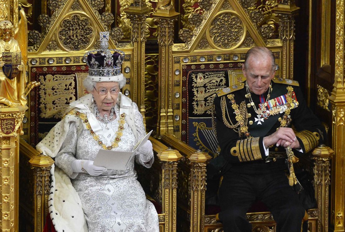Queen Elizabeth II sits on a gilded throne as she delivers her speech on May 8, 2013.