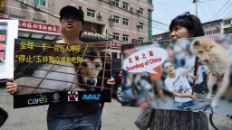 Animal activists display protest banners outside the Yulin government office in Beijing on June 10, 2016.
A group of Chinese and international animal activists presented a petition signed by 11 million people calling on authorities to end the annual Yulin dog meat festival. The activists claim thousands of dogs, many of the them stolen from pet owners, are slaughtered each year for the  festival, which begins in the southern city of Yulin on June 21. / AFP / GREG BAKER        (Photo credit should read GREG BAKER/AFP/Getty Images)