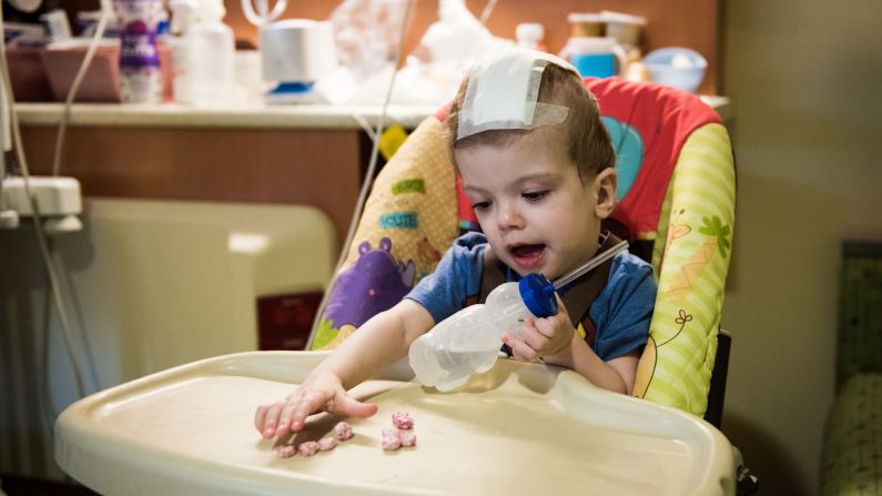 Jadon eats small snacks and drinks from a sippy cup on his own, major progress since he first moved to rehab.