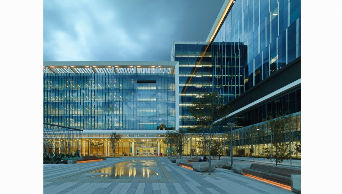 In addition to a 315-inpatient bed hospital and an ambulatory care center, the 37-acre LEED Gold campus by HOK includes a farmers' market, six healing gardens, and a green roof that supplies produce to the hospital and restaurant.