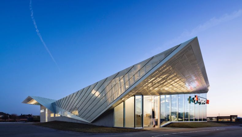 5G Studio Collaborative is behind this zinc-clad emergency room and urgent care center in Texas. The interior is flooded with light from floor-to-ceiling windows and multiple skylights. 