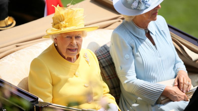 Britain's Queen Elizabeth II dashed from the State Opening of Parliament to take her place in the Royal Procession alongside Camilla, the Duchess of Cornwall, on day two of Royal Ascot.