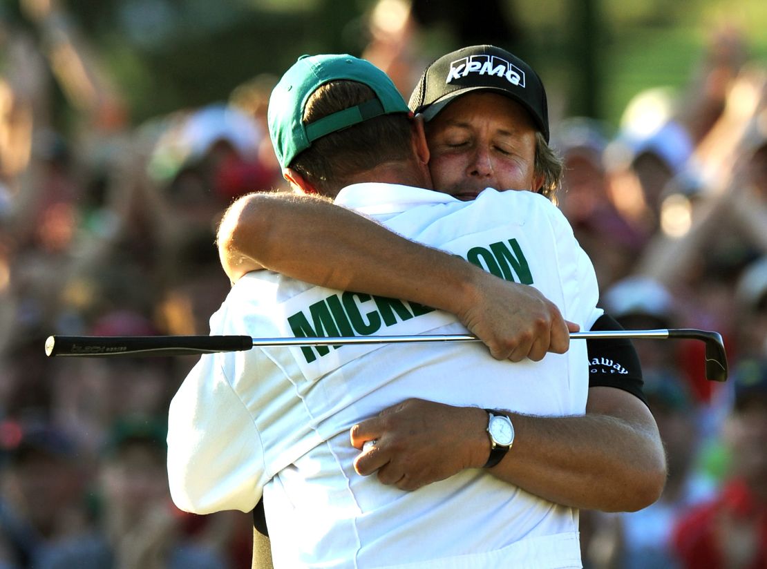 Mickelson hugs caddie "Bones" after winning the 2010 Masters at Augusta.