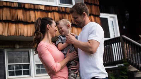 Nicole and Christian McDonald with their 3-year-old son, Aza, outside the family's new home in upstate New York.