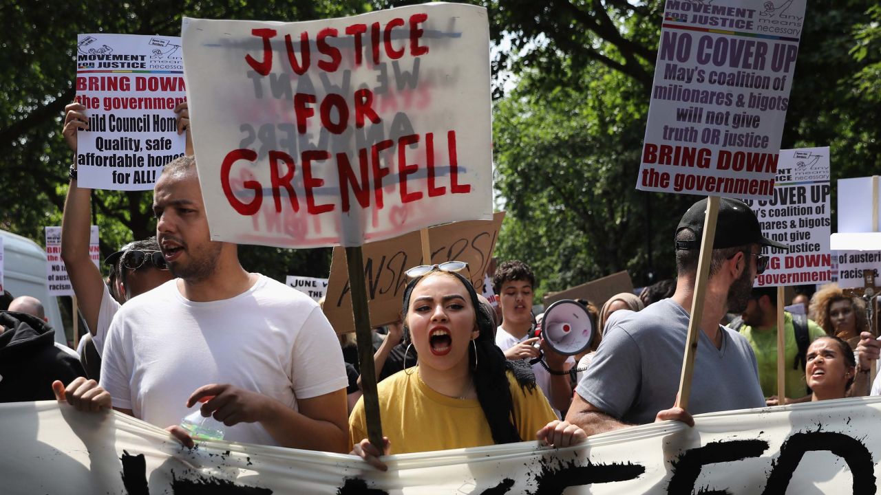 LONDON, ENGLAND - JUNE 21:  Protesters hold signs calling for justice for the victims of the Grenfell Disaster and shout slogans as they march towards Westminster during an anti-government protest on June 21, 2017 in London, England. A series of protests are held in the capital in response to the Queen's Speech including a "Day of Rage" organised by the Movement for Justice By Any Means Necessary.  The Clement James Centre helping residents of the Grenfell disaster have emphasised that they do not want their grief hijacked for violent means.  (Photo by Dan Kitwood/Getty Images)
