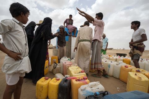 Yemenis collect drinking water at a camp for internally displaced people. Water is heavily rationed at the camp, and is only available during three one-hour windows each day. The UN says 14.5 million people in Yemen need help to access safe water and sanitation.
