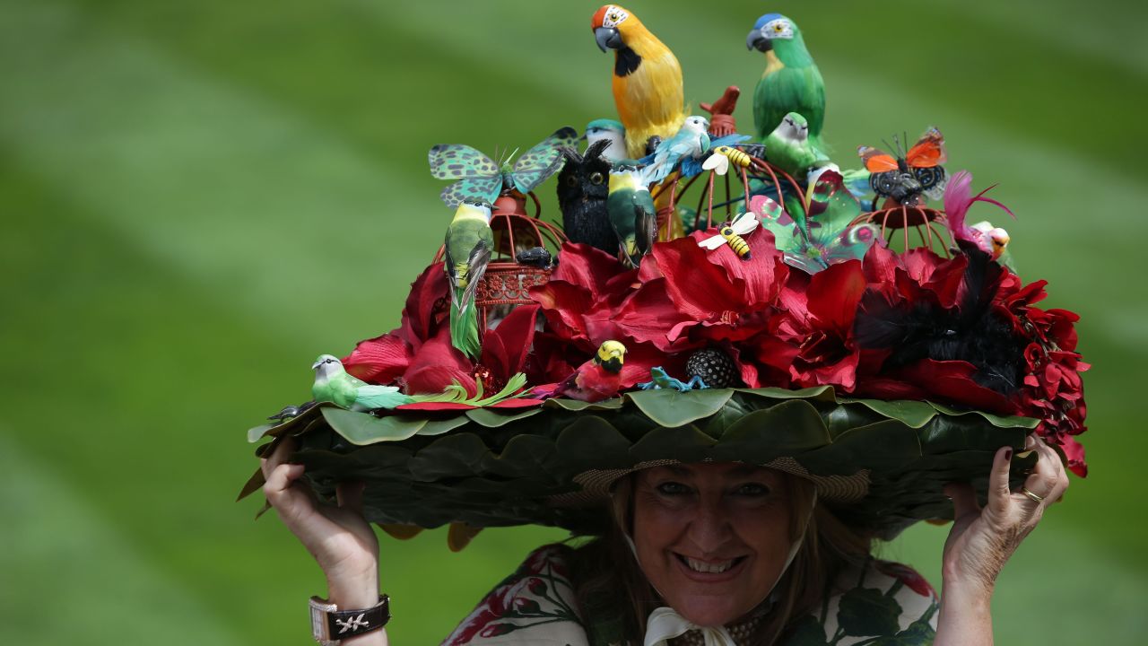 A little birdie told us that this is a picture of Paula Gibson from Argentina, who poses with her floral hat as she attends the third day of the five-day meeting. 