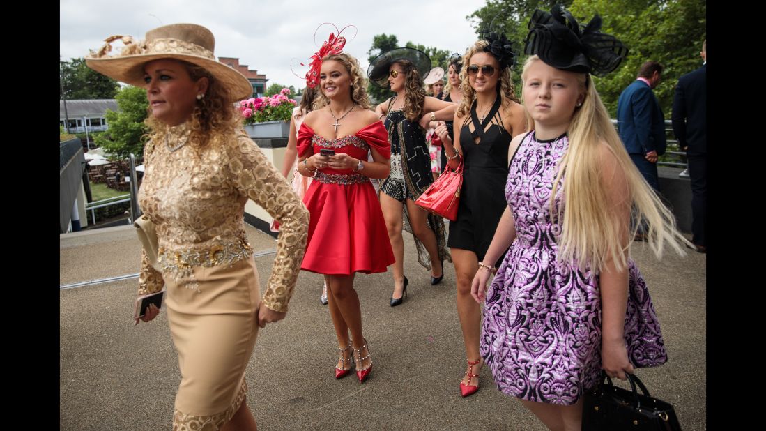 Racegoers arrive on day 3 of Royal Ascot at Ascot Racecourse on June 22, 2017 in Ascot, England. The five-day Royal Ascot meeting is one of the highlights of the horse racing calendar and has been held at the famous Berkshire course since 1711. 