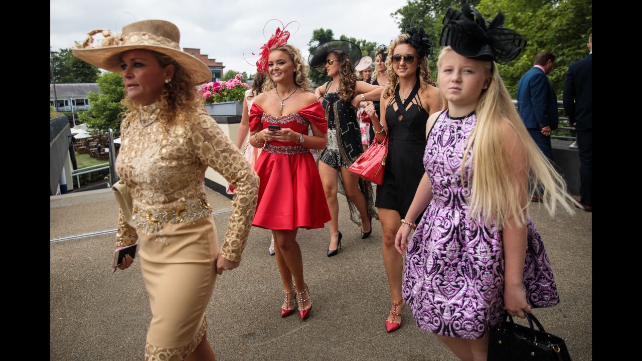 Racegoers arrive on day 3 of Royal Ascot at Ascot Racecourse on June 22, 2017 in Ascot, England. The five-day Royal Ascot meeting is one of the highlights of the horse racing calendar and has been held at the famous Berkshire course since 1711. 