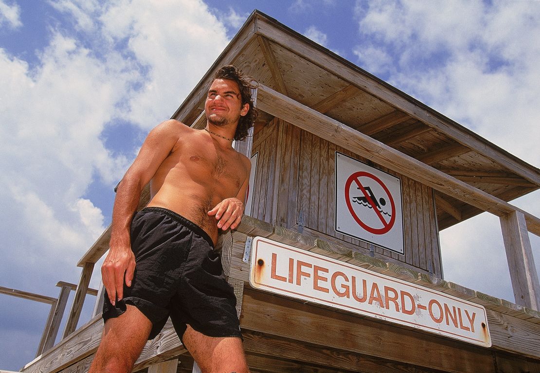 A teenage Federer is pictured relaxing on a beach in Key Biscayne, Florida.