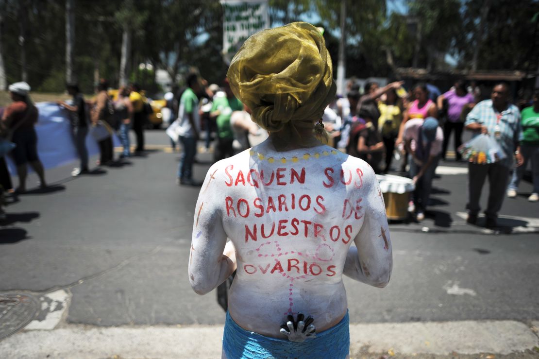 At an abortion rights demonstration, this campaigner has a message for the Catholic Church: "Keep your rosaries away from our ovaries."