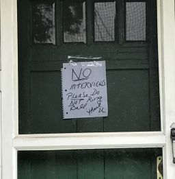A note saying "NO interviews" was taped to the door of a juror's home.