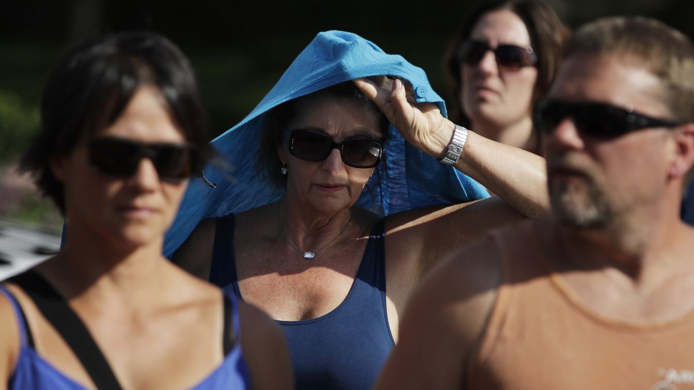 A woman shields herself from the sun while walking along the Las Vegas Strip on June 20.