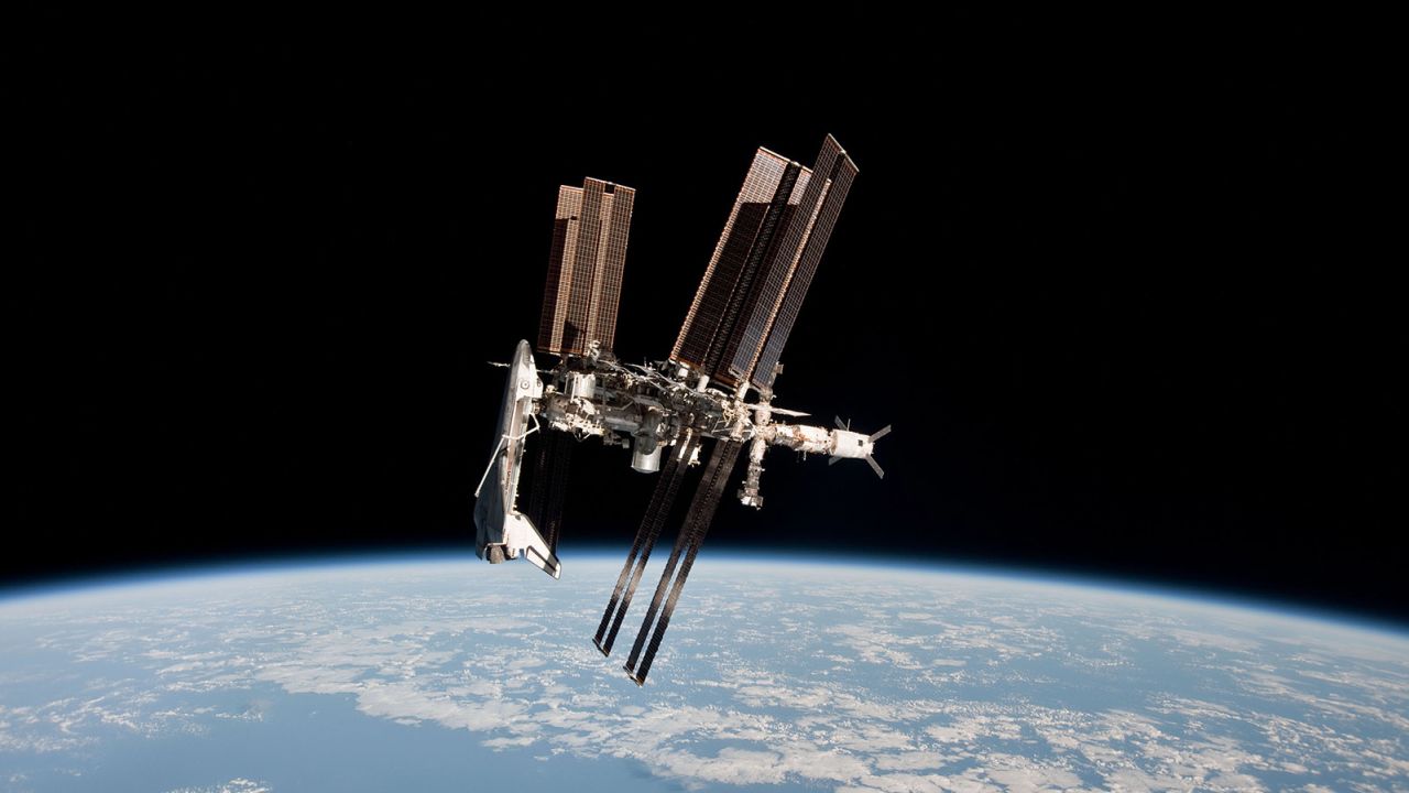 In this handout image provided by the European Space Agency (ESA) and NASA, the International Space Station and the docked space shuttle Endeavour orbit Earth during Endeavour's final sortie on May 23, 2011 in Space.