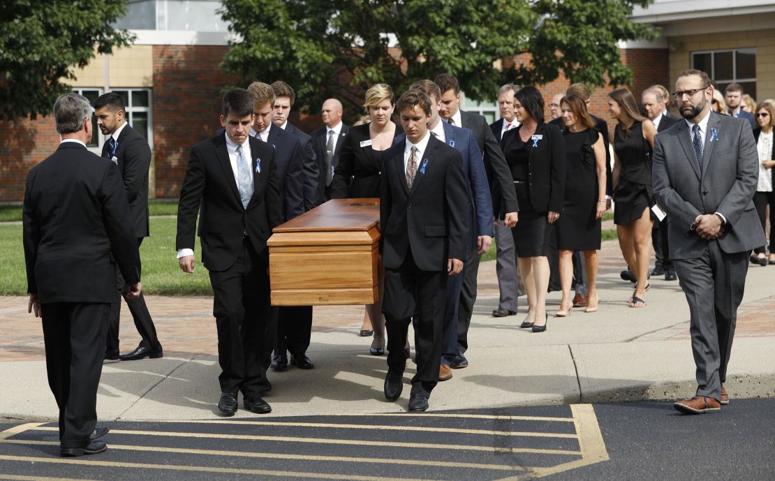 Pallbearers carry Otto Warmbier's casket from  Wyoming High School on Thursday. 